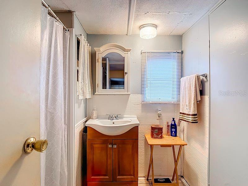 8145 Campbell Court New Port Richey, FL 34653 - Photo 19 of 34 a kitchen with stainless steel appliances a sink and cabinets