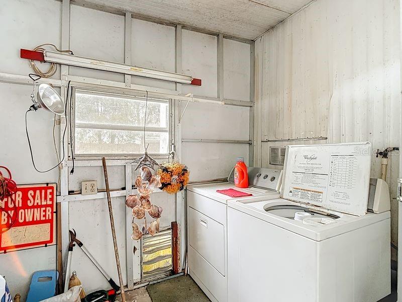 8145 Campbell Court New Port Richey, FL 34653 - Photo 23 of 34 a utility room with dryer and washer