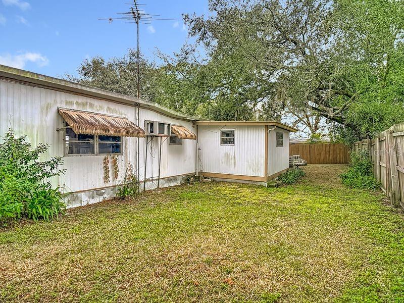 8145 Campbell Court New Port Richey, FL 34653 - Photo 30 of 34 a white house that has a tree in front of it
