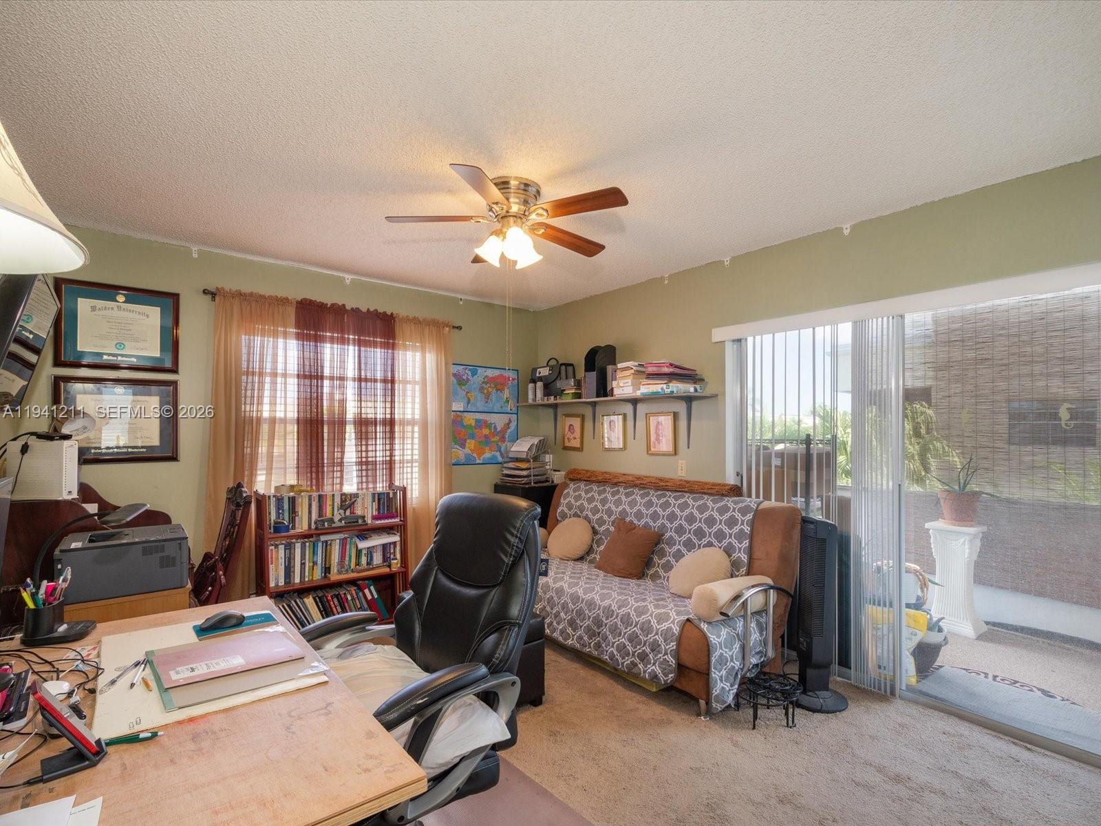 414 Capri H, Unit 414 Delray Beach, FL 33484 - Photo 14 of 19 a bedroom with furniture and a chandelier