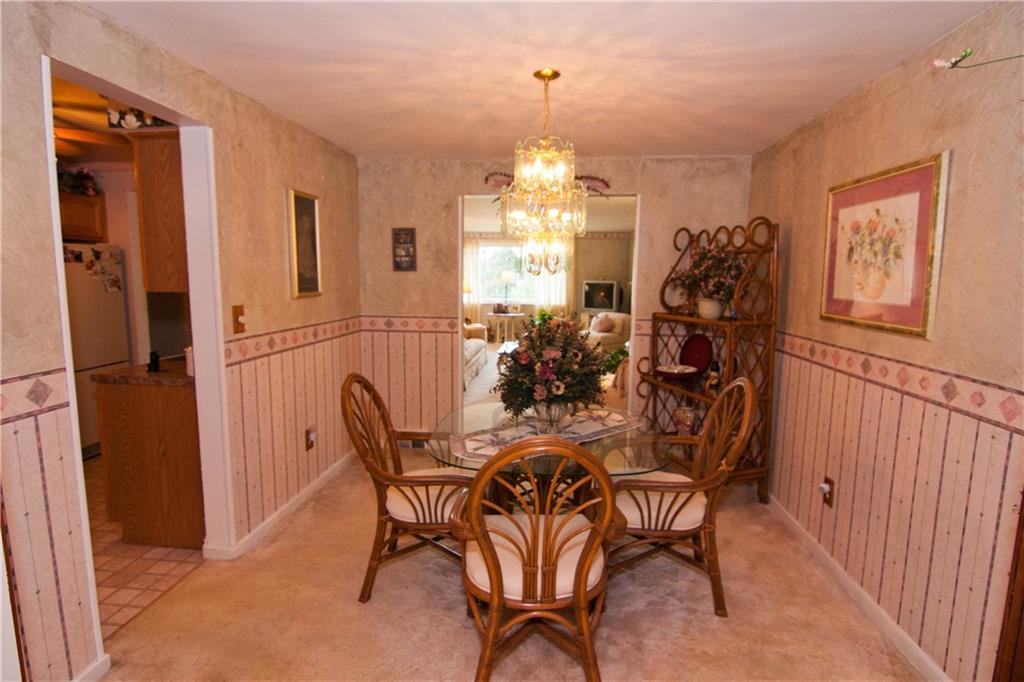 900 Rosalind Road Pittsburgh, PA 15237 - Photo 3 of 10 The 11.10 Dining Room features wall-to-wall carpeting and also has hardwood flooring beneath.