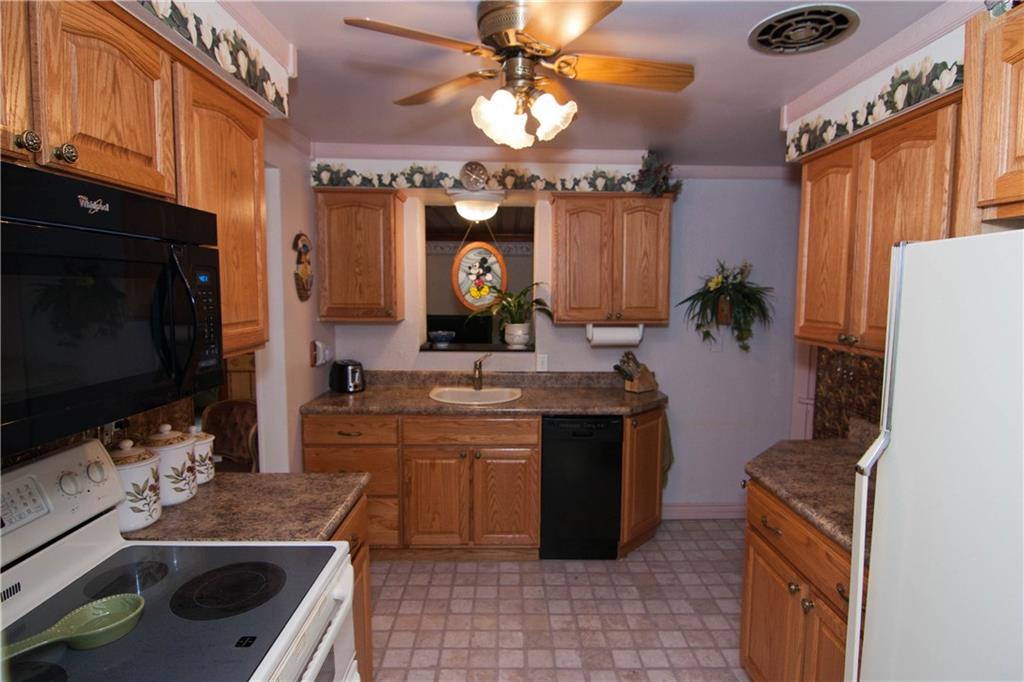 900 Rosalind Road Pittsburgh, PA 15237 - Photo 5 of 10 The 11x9 Kitchen has oak cabinetry. Most of the appliances are included.