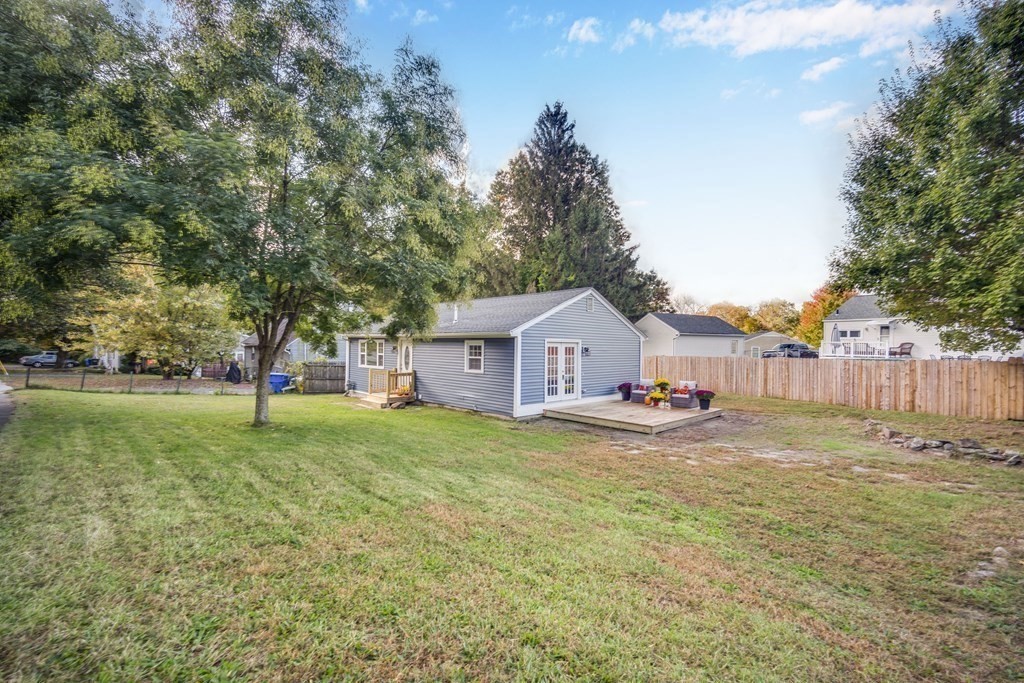 858 Bradley Road Springfield, MA 01109 - Photo 3 of 36 a view of a house with a yard and trees