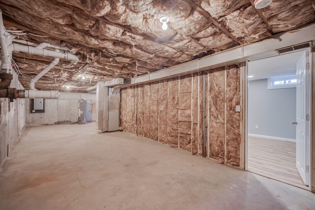 858 Bradley Road Springfield, MA 01109 - Photo 33 of 36 a view of a room with an empty space and wooden walls