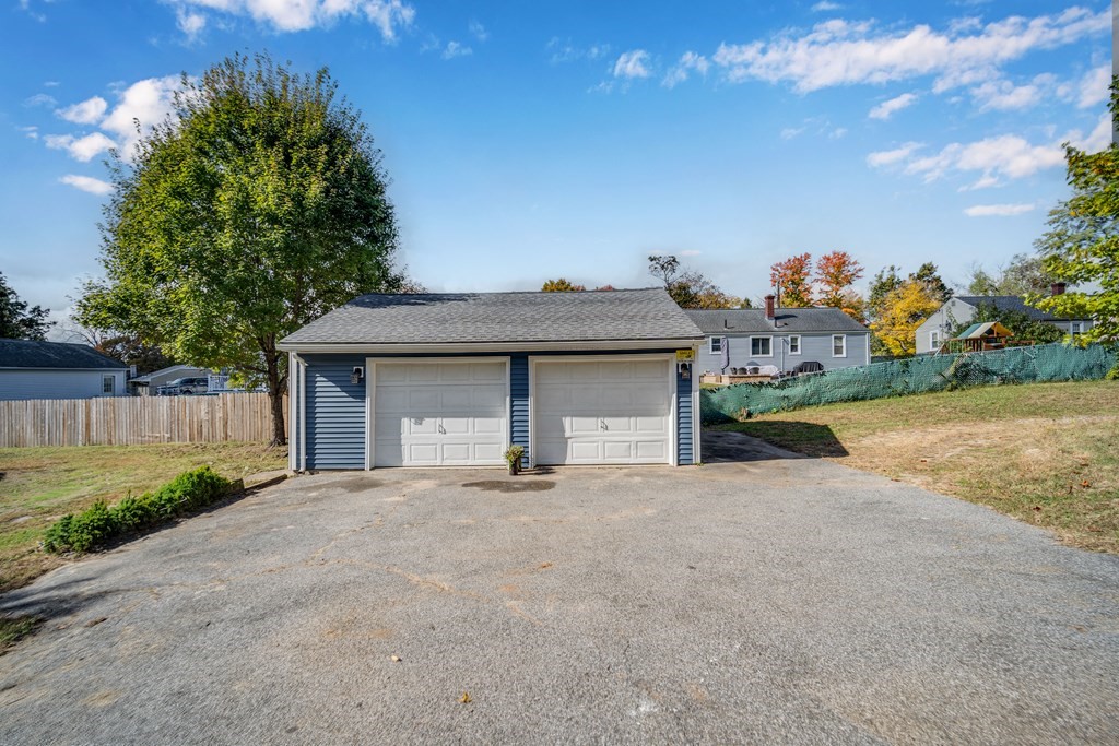 858 Bradley Road Springfield, MA 01109 - Photo 36 of 36 a view of a house with a yard and garage
