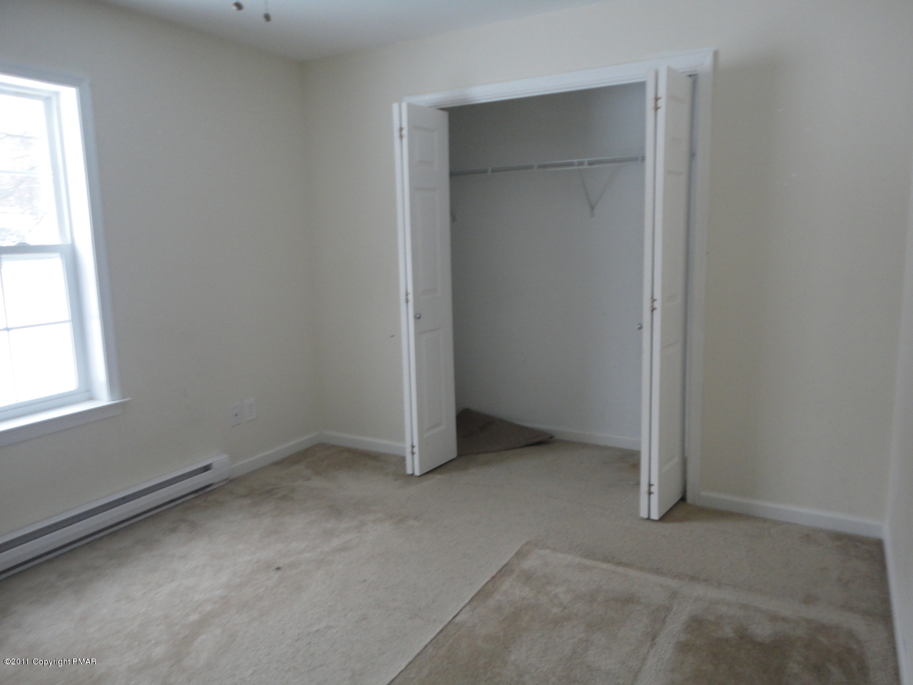 701 Mountain Road Albrightsville, PA 18210 - Photo 2 of 5 an empty room with a empty space and window