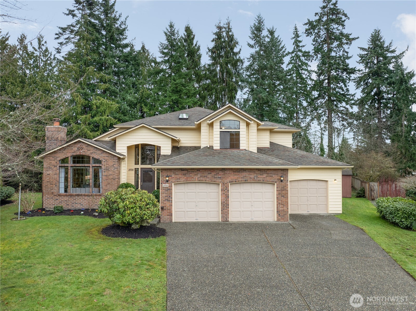 2700 234th Street Southwest Brier, WA 98036 - Photo 1 of 38 a front view of a house with a garden and trees