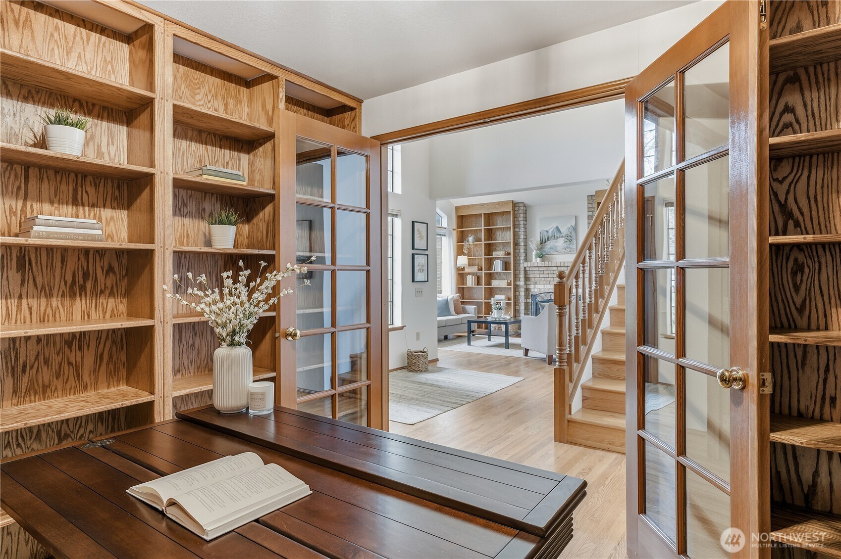 2700 234th Street Southwest Brier, WA 98036 - Photo 13 of 38 a view of staircase with wooden floor and book shelf