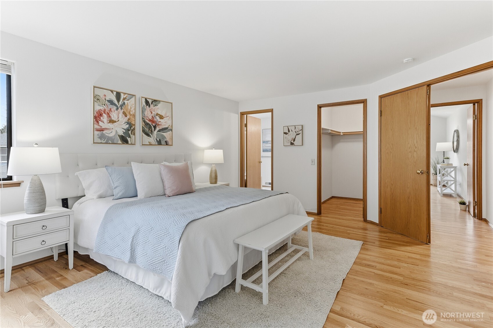 2700 234th Street Southwest Brier, WA 98036 - Photo 17 of 38 a spacious bedroom with a bed and wooden floor