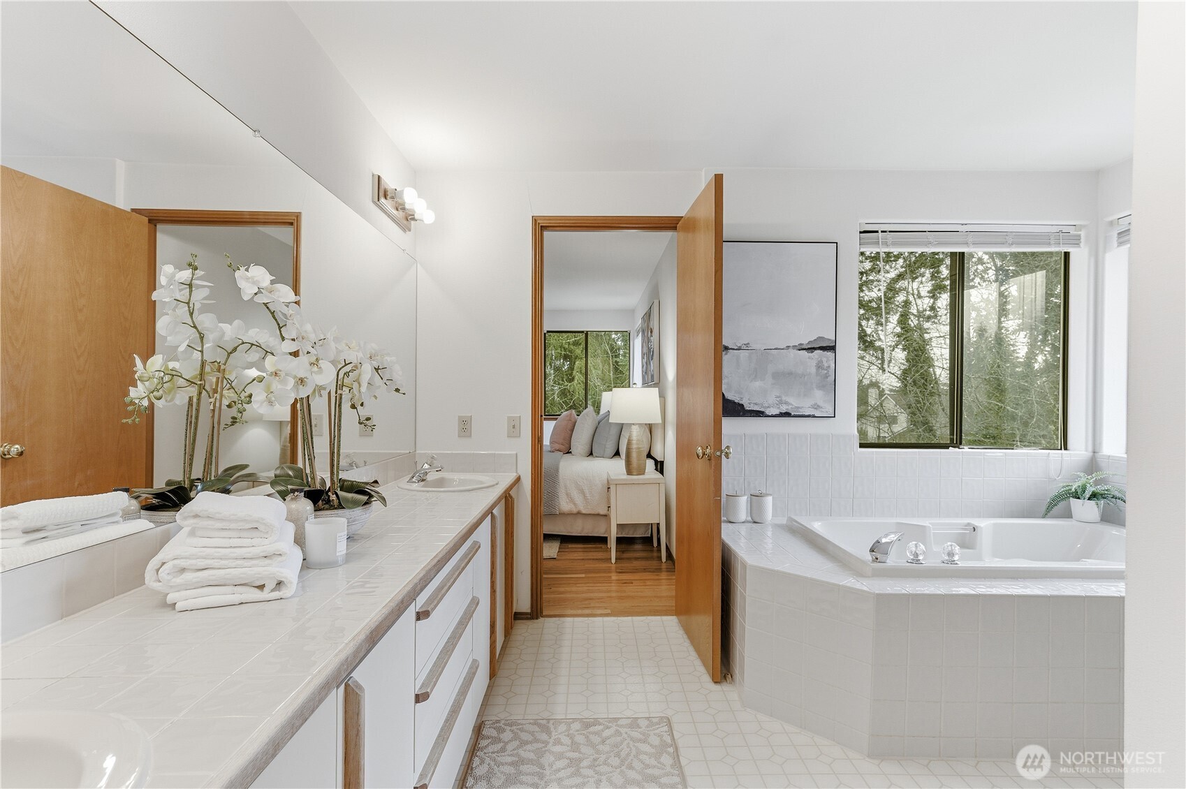 2700 234th Street Southwest Brier, WA 98036 - Photo 18 of 38 a bathroom with a granite countertop tub a double vanity sink a mirror and a shower