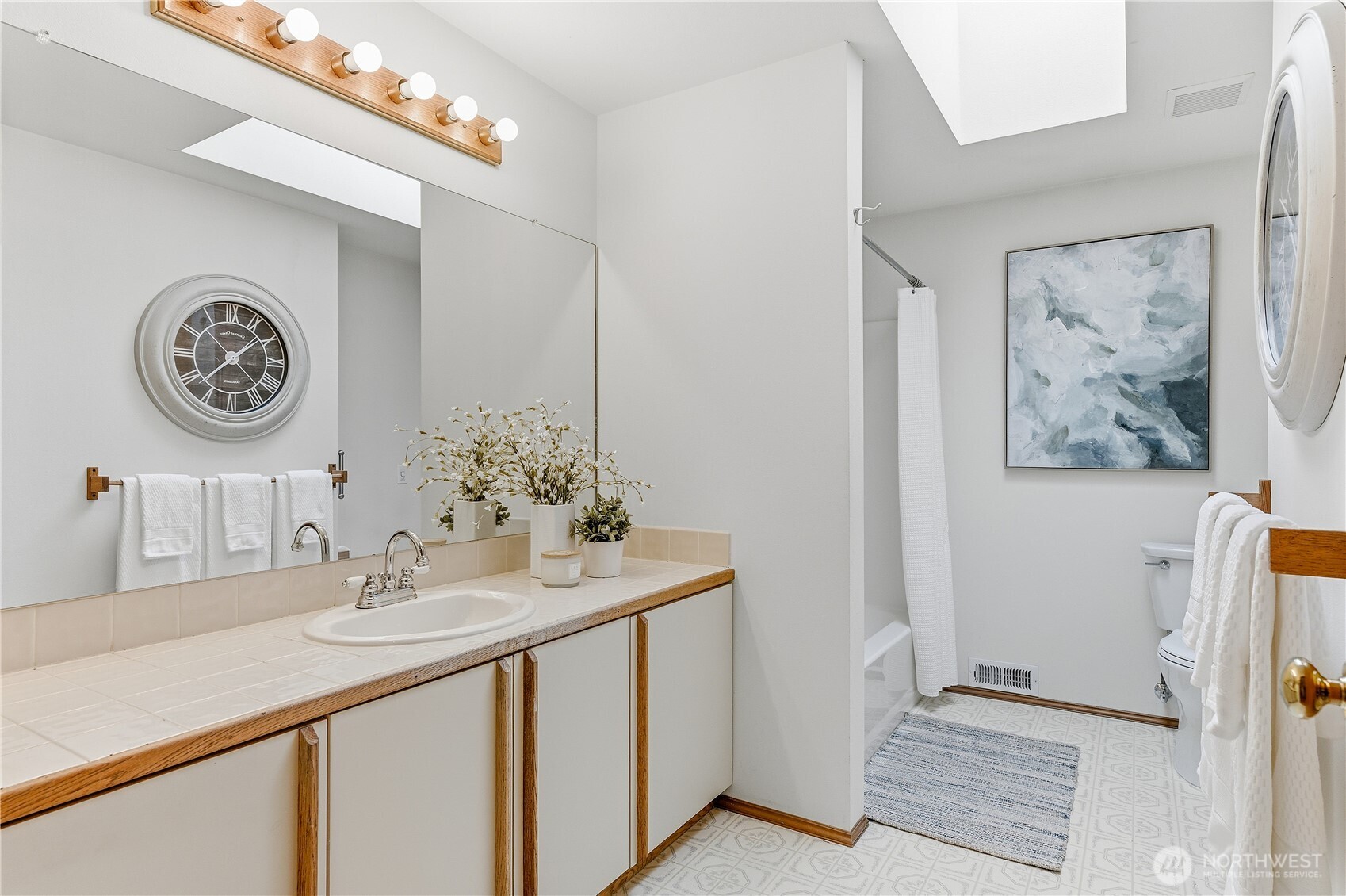 2700 234th Street Southwest Brier, WA 98036 - Photo 26 of 38 a bathroom with a sink and a mirror