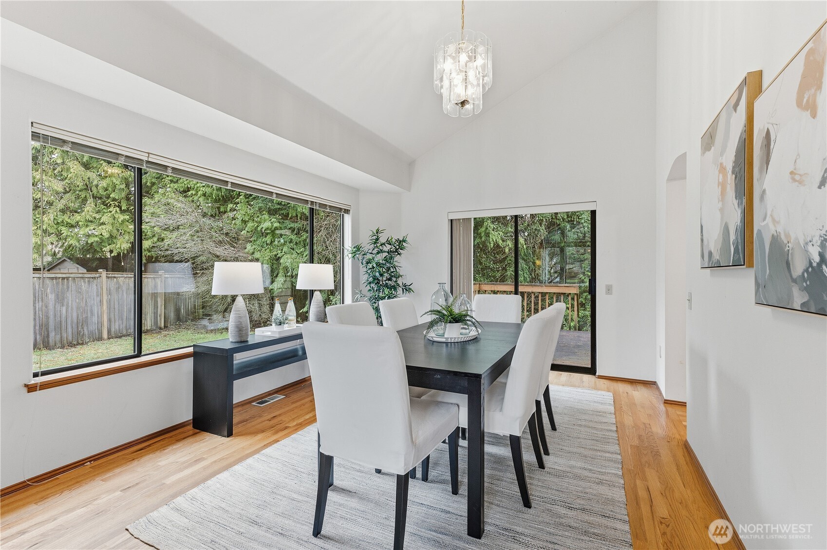 2700 234th Street Southwest Brier, WA 98036 - Photo 5 of 38 a view of a dining room with furniture large windows and wooden floor