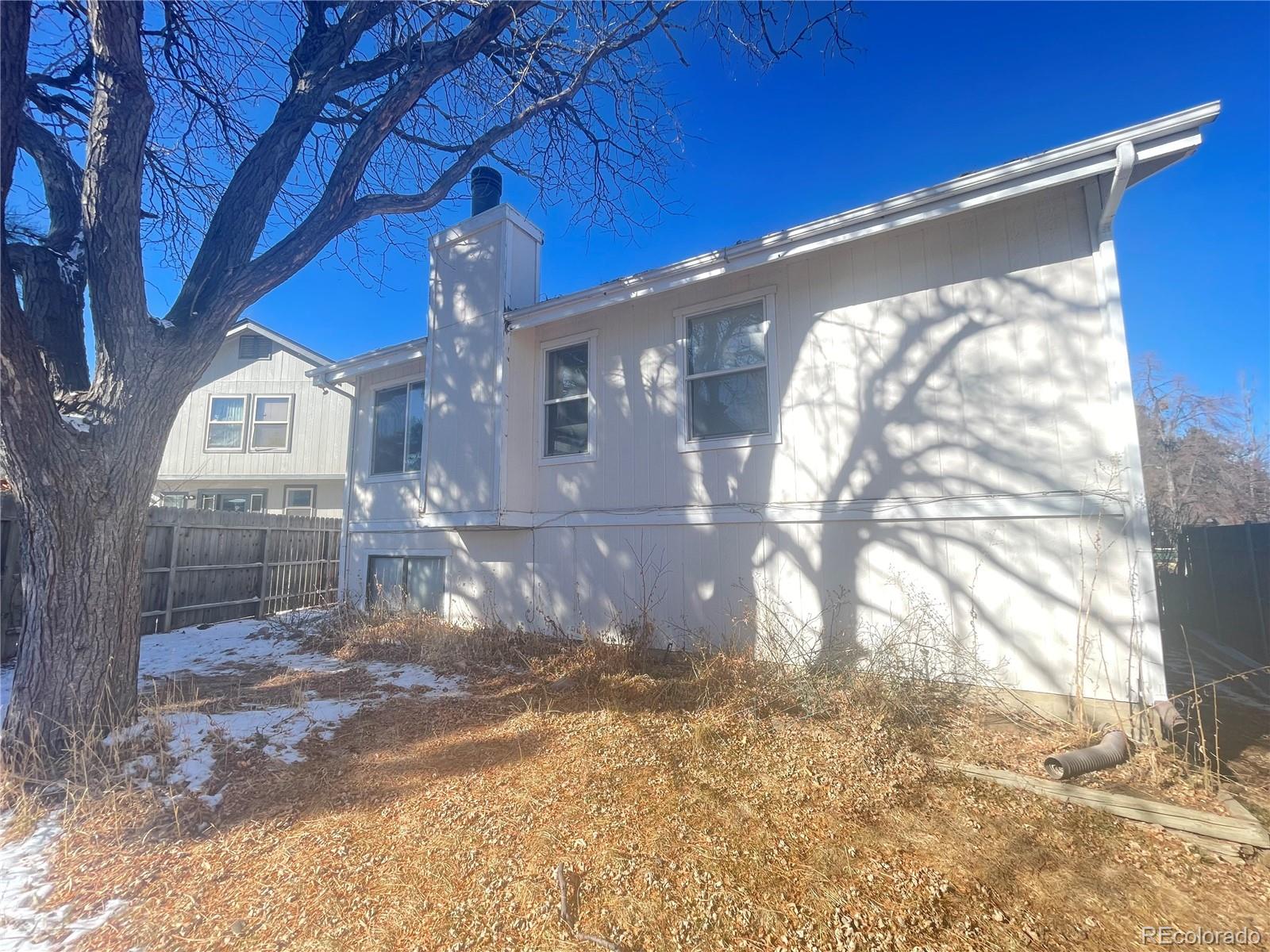 3817 South Ceylon Way Aurora, CO 80013 - Photo 18 of 18 a view of a house with a yard