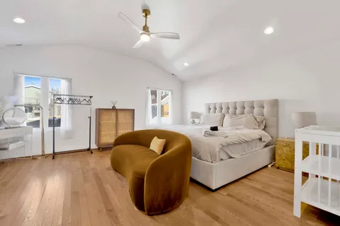 a bedroom with a bed and a couch