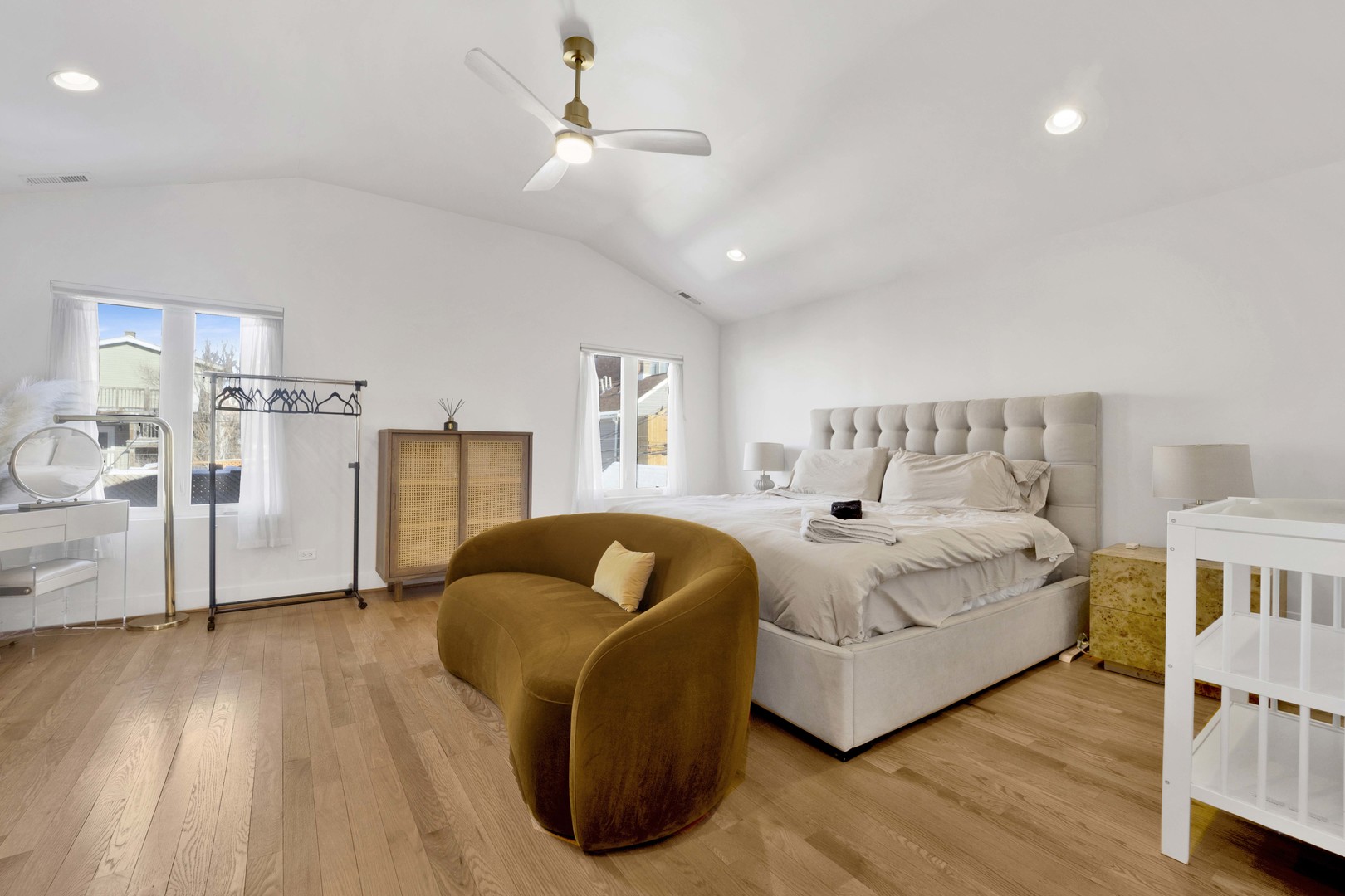 2648 West Homer Street Chicago, IL 60647 - Photo 22 of 49 a spacious bedroom with a bed and a couch