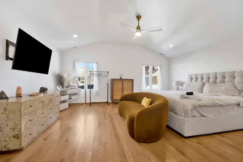 a bathroom with a sink a large mirror and a light fixture