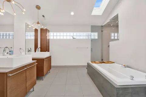 a bathroom with a bathtub and a shower