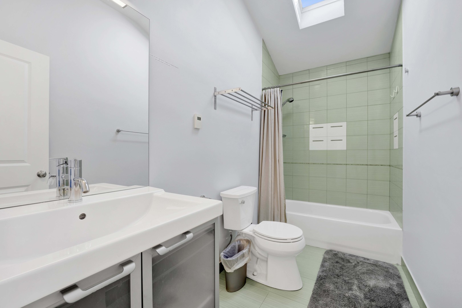 2648 West Homer Street Chicago, IL 60647 - Photo 32 of 49 a bathroom with a sink toilet and shower