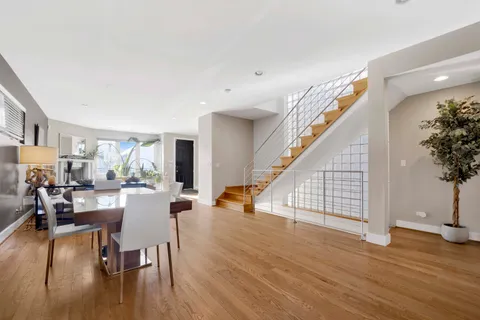 a bathroom with a sink a toilet a mirror and shower curtain