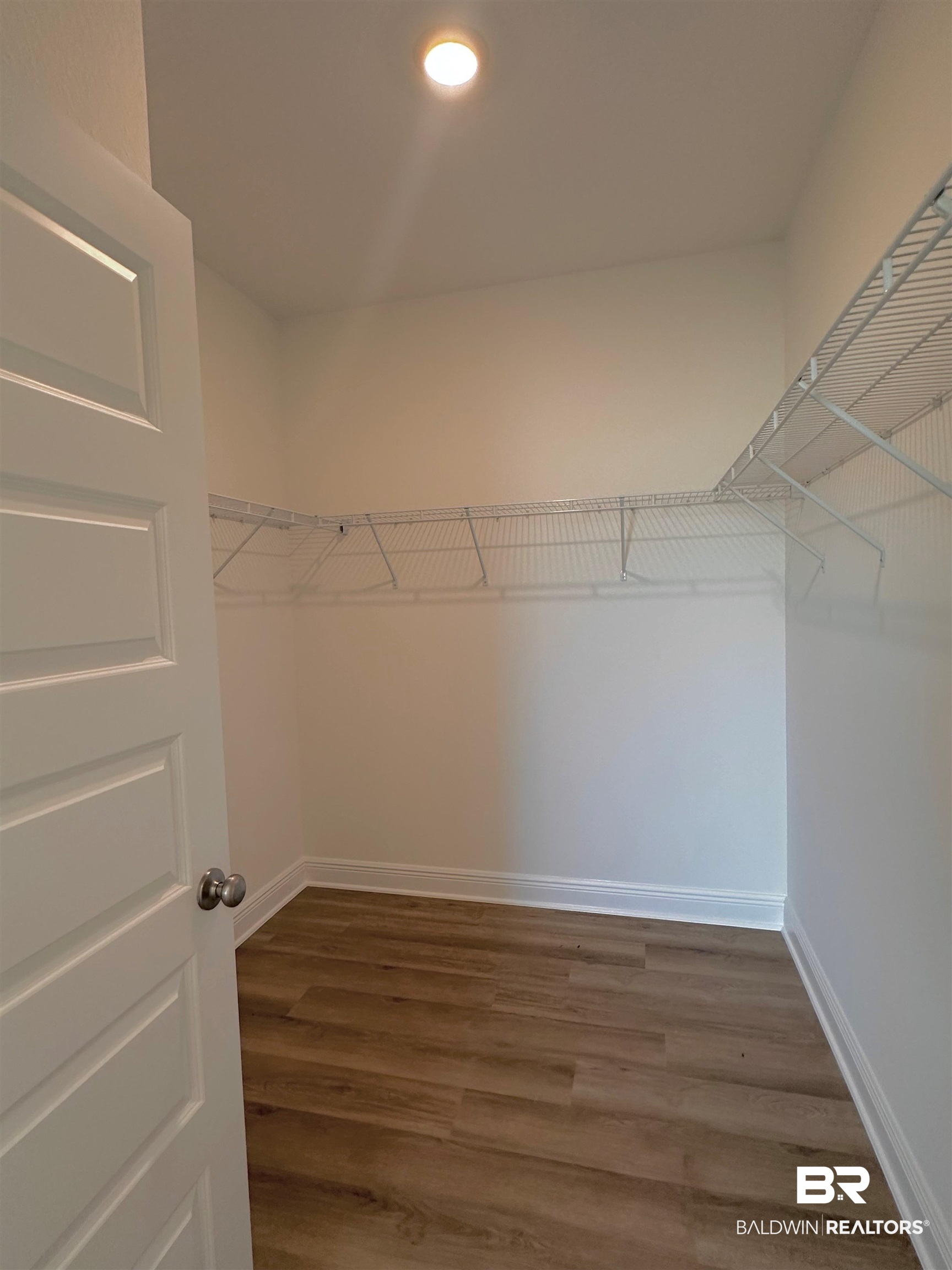 12946 Grand Rpds Road Fairhope, AL 36532 - Photo 13 of 19 Spacious closet with hardwood / wood-style floors