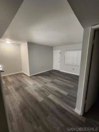 a white toilet sitting next to a white sink
