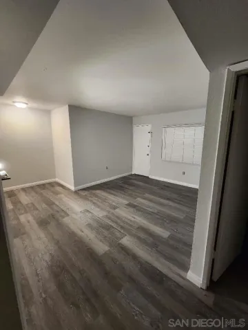 a white toilet sitting next to a white sink