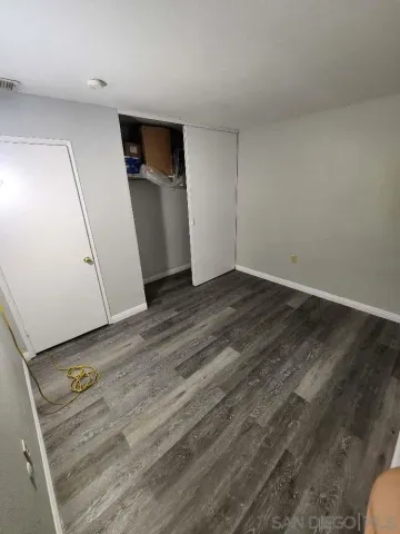 a kitchen with sink and cabinets
