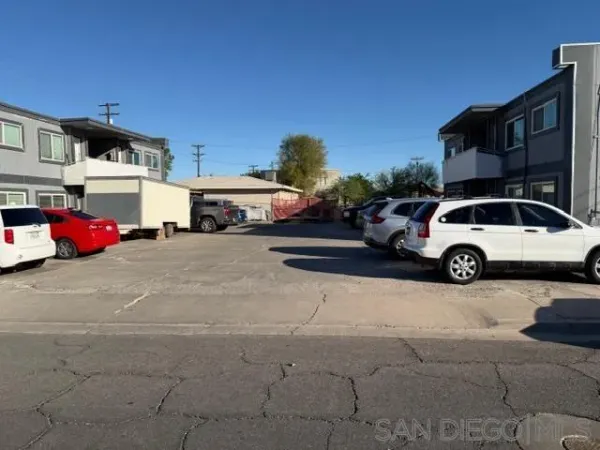 a view of cars parked in front of a building
