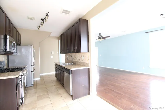 a kitchen with a stove and a sink