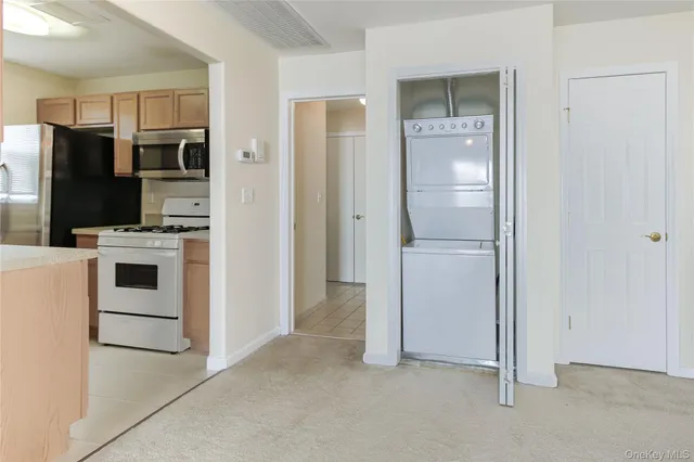 a view of a kitchen with a sink and an oven