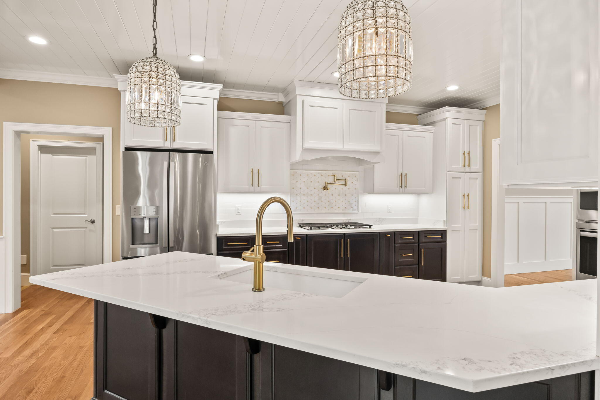 7 Nicklaus Way Mashpee, MA 02649 - Photo 13 of 45 a kitchen with granite countertop a sink cabinets and chandelier