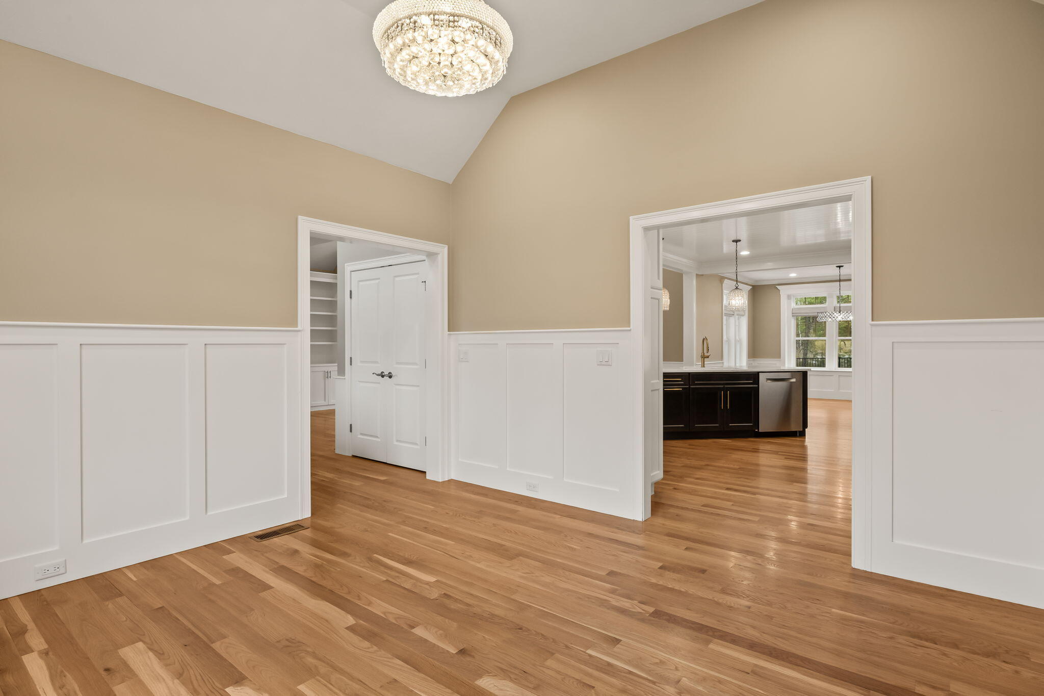 7 Nicklaus Way Mashpee, MA 02649 - Photo 19 of 45 a view of a room with wooden floor and a kitchen space
