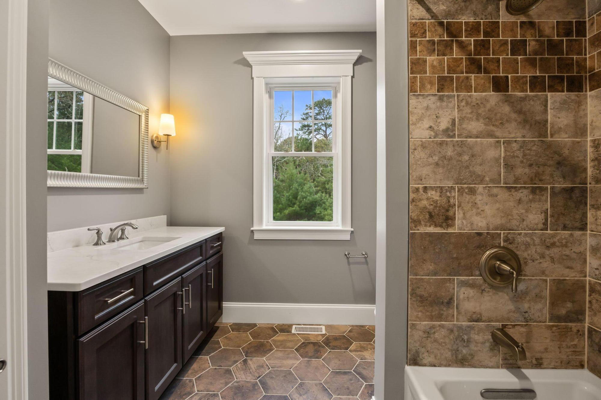 7 Nicklaus Way Mashpee, MA 02649 - Photo 22 of 45 a bathroom with a sink a vanity and a shower
