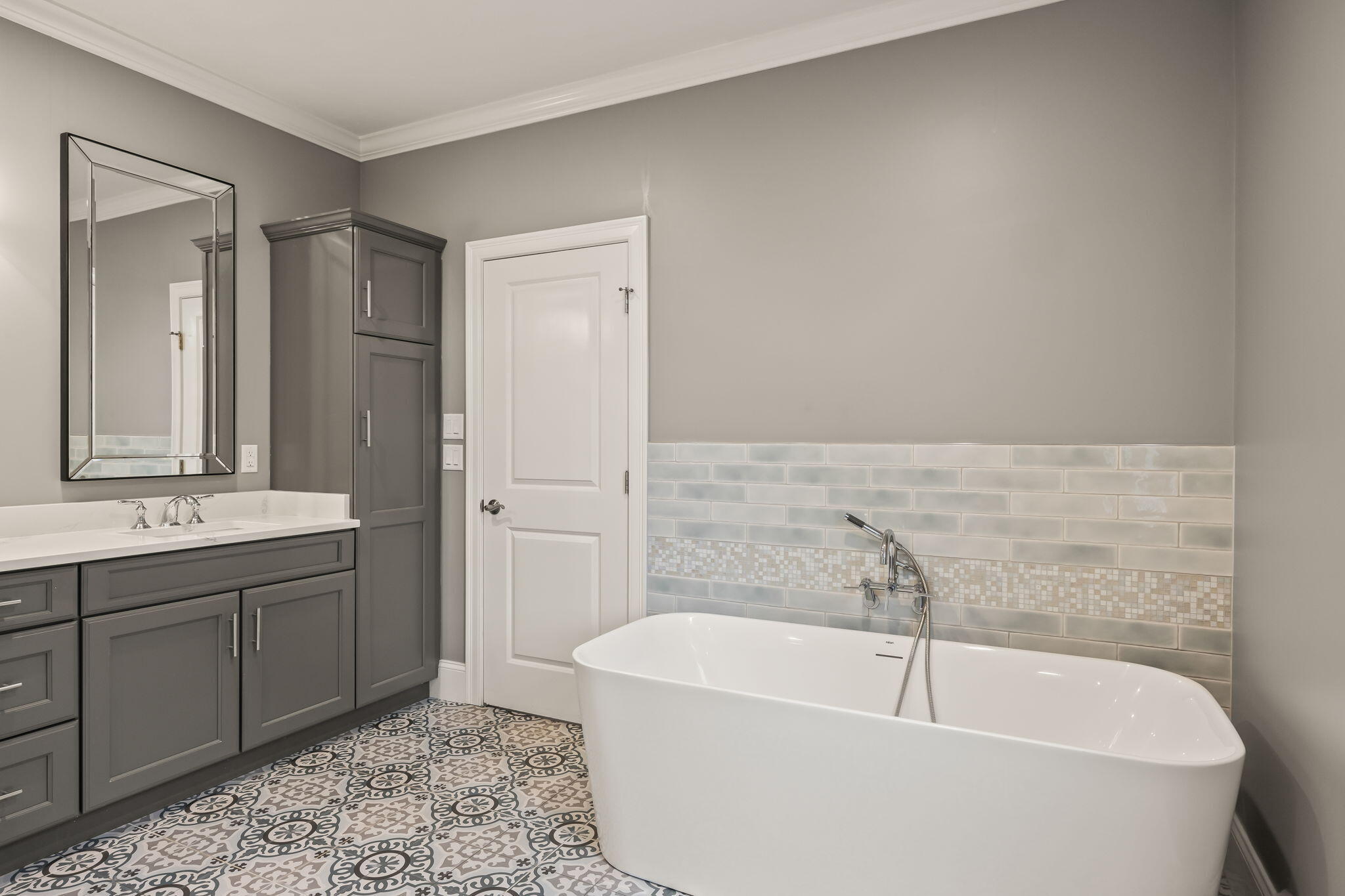 7 Nicklaus Way Mashpee, MA 02649 - Photo 32 of 45 a bathroom with a tub a sink and wooden floor