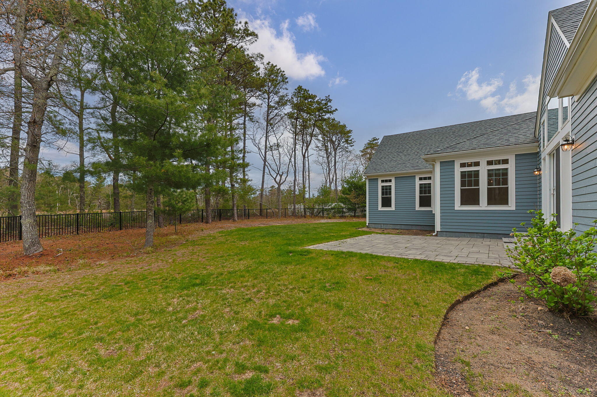 7 Nicklaus Way Mashpee, MA 02649 - Photo 39 of 45 a view of a house with a backyard
