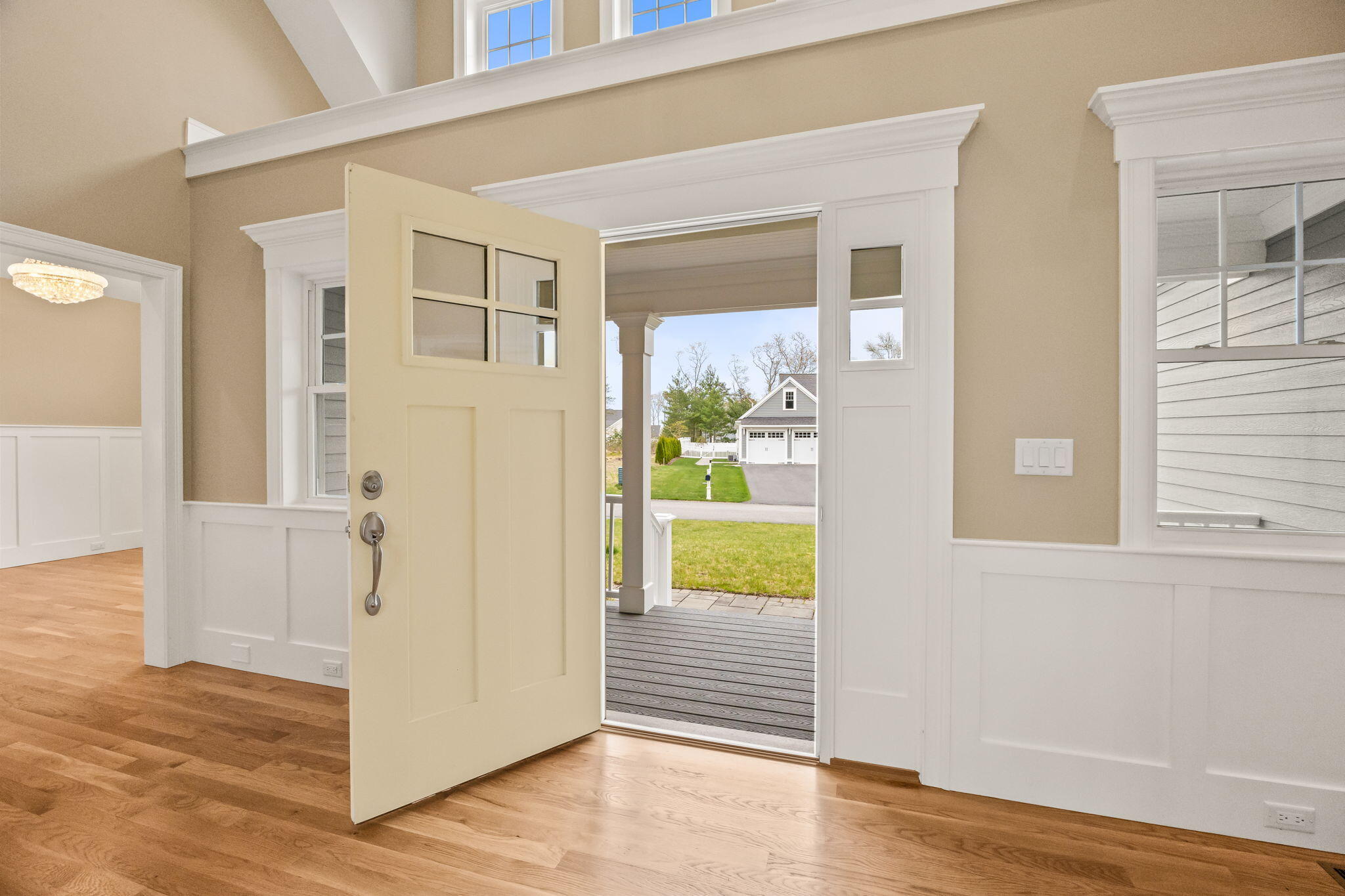 7 Nicklaus Way Mashpee, MA 02649 - Photo 4 of 45 a view of a hallway with wooden floor and a living room