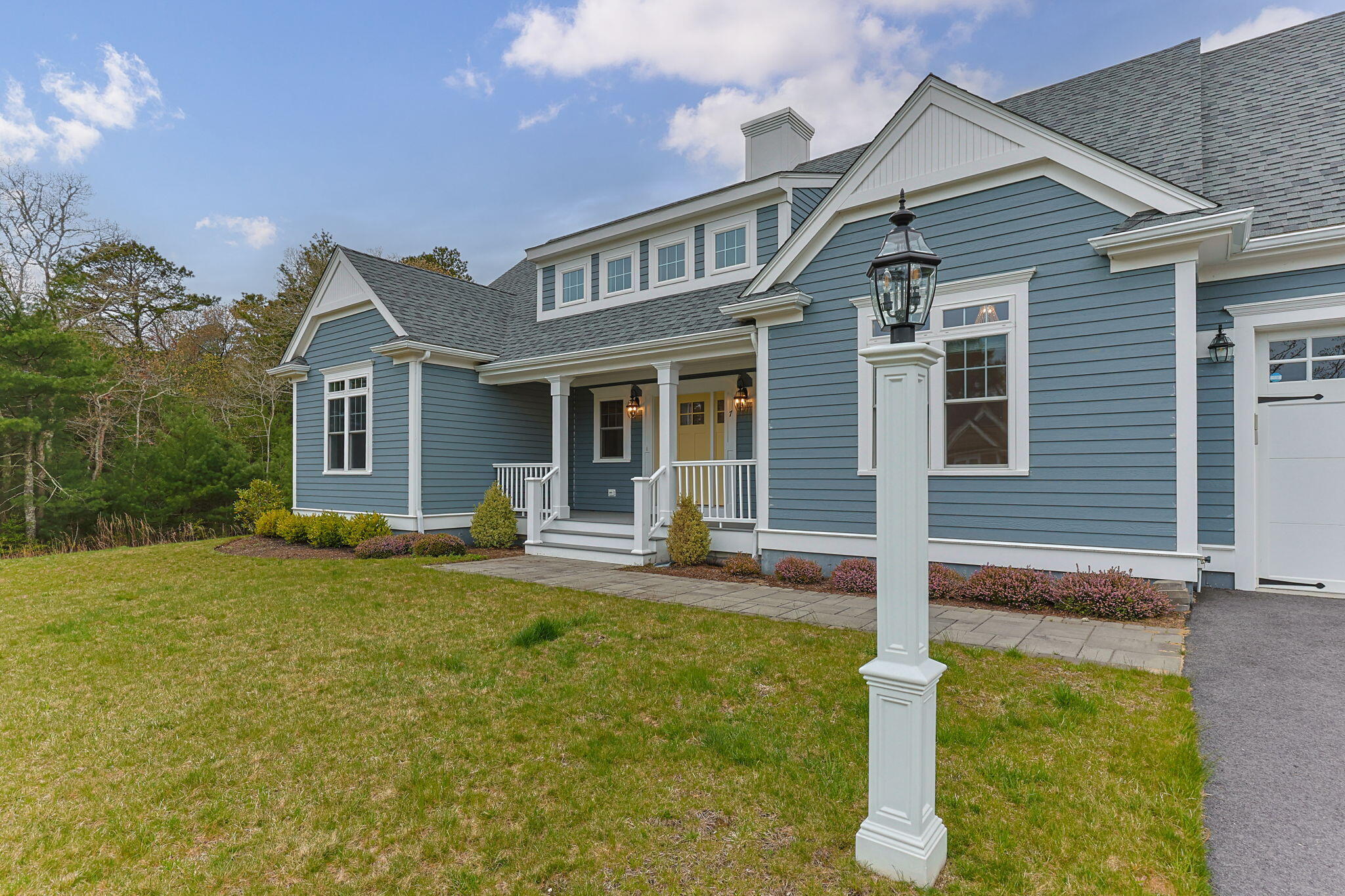 7 Nicklaus Way Mashpee, MA 02649 - Photo 42 of 45 a front view of a house with a yard
