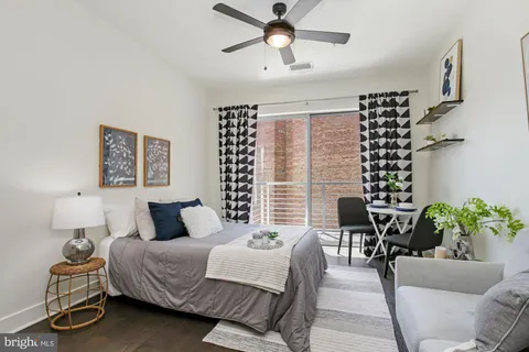 a bedroom with a bed furniture and window