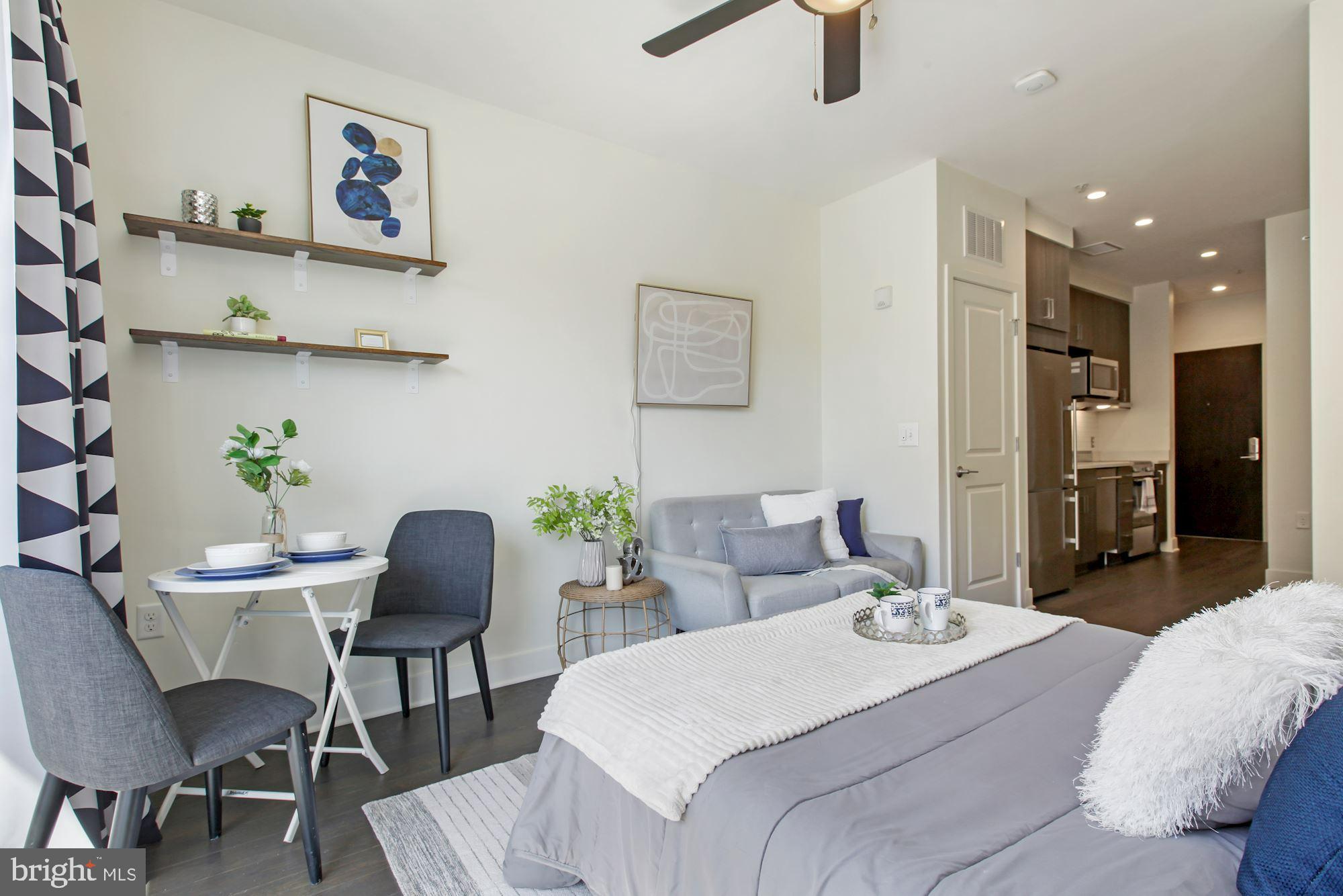 2550 17th Street Northwest, Unit 302 Washington, DC 20009 - Photo 5 of 19 a living room with furniture and a table