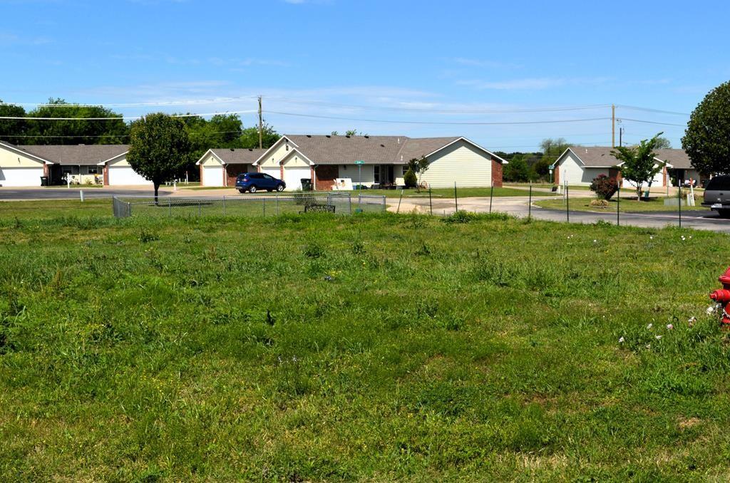 208 Preston Road Mabank, TX 75147 - Photo 1 of 3 a view of a garden with lawn chairs