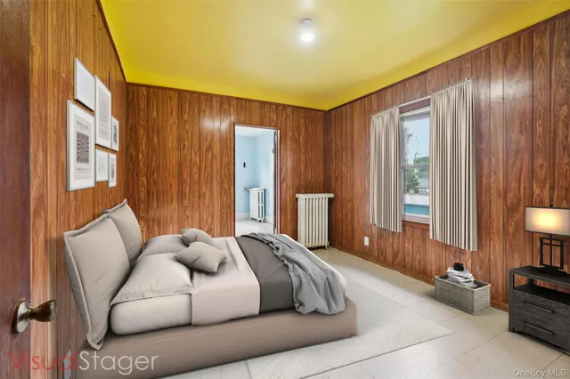 a spacious bedroom with a bed and large windows