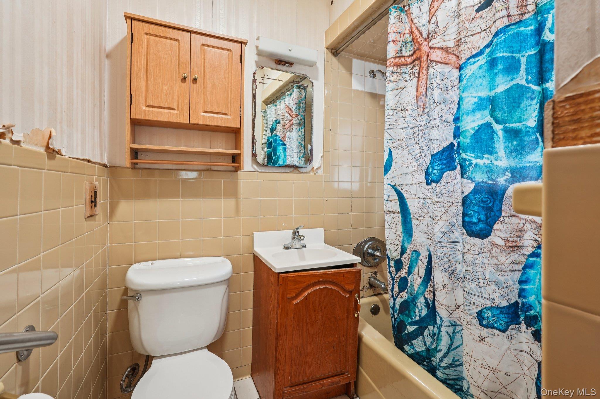 334 Union Avenue Peekskill, NY 10566 - Photo 15 of 20 a bathroom with a toilet sink and mirror