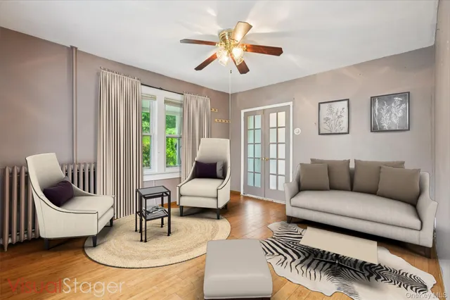 a living room with furniture and a large window