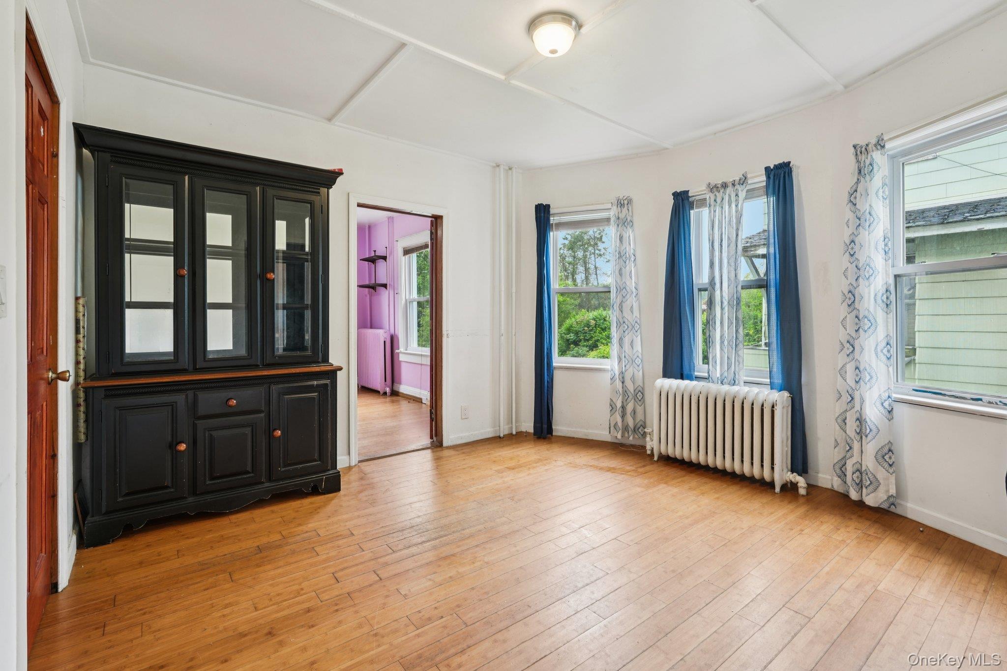 334 Union Avenue Peekskill, NY 10566 - Photo 5 of 20 wooden floor in an empty room with a window