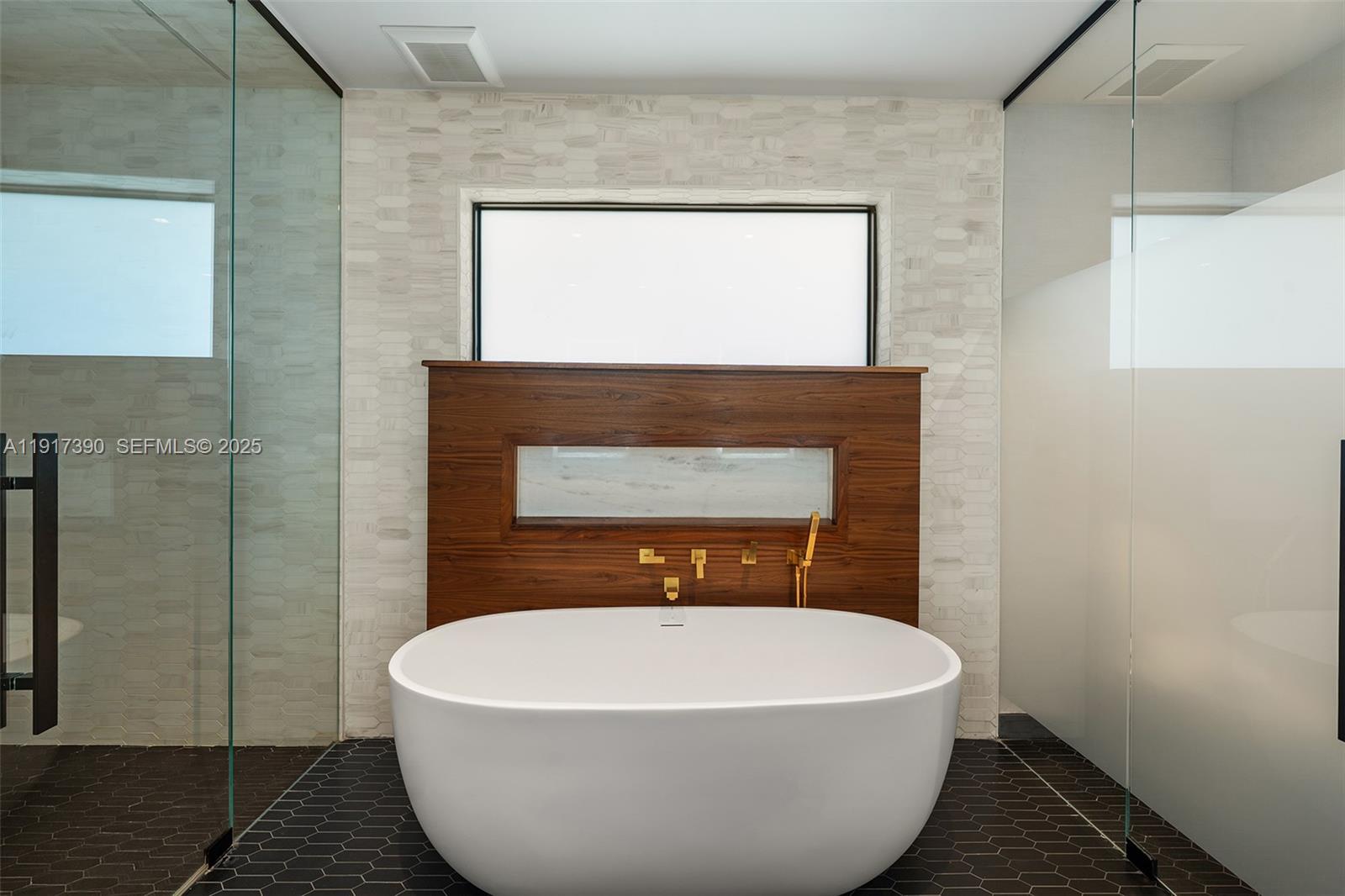 900 Washington Street Hollywood, FL 33019 - Photo 31 of 61 a white bath tub sitting in a bathroom