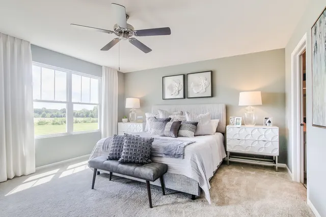 a bedroom with a bed and a couch