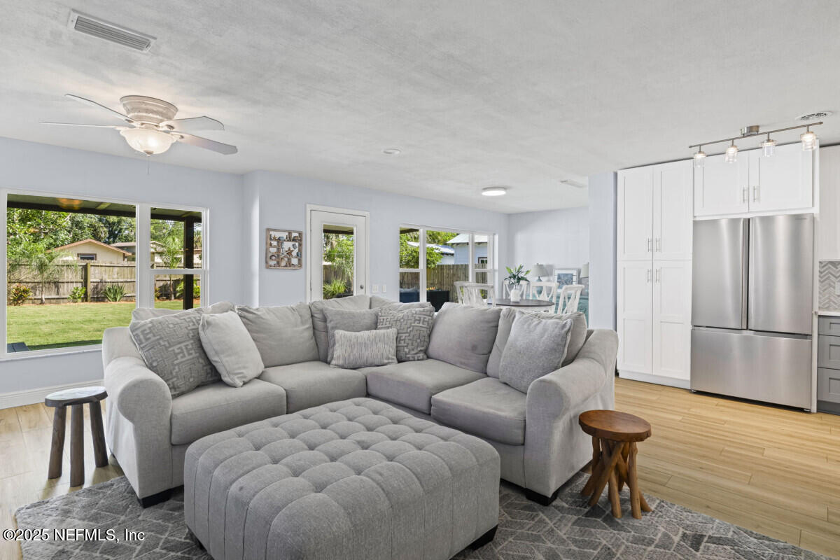 1901 Tanglewood Road Jacksonville Beach, FL 32250 - Photo 11 of 48 a living room with furniture and a large window