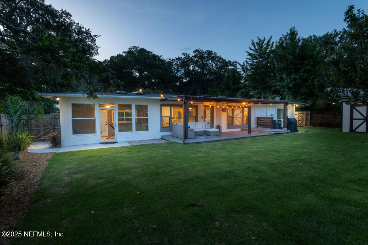 1901 Tanglewood Road Jacksonville Beach, FL 32250 - Photo 17 of 48 a view of a house with backyard and porch