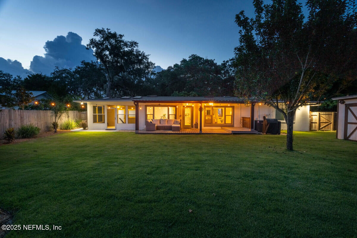 1901 Tanglewood Road Jacksonville Beach, FL 32250 - Photo 18 of 48 a front view of a house with a big yard