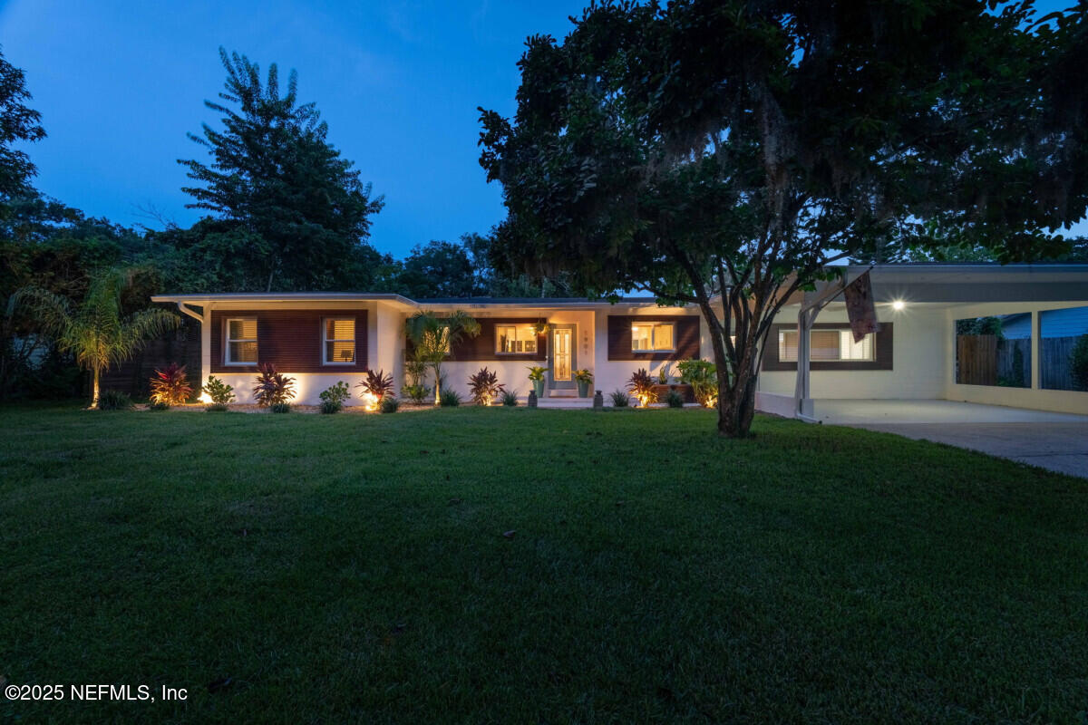 1901 Tanglewood Road Jacksonville Beach, FL 32250 - Photo 19 of 48 a view of house with outdoor space and garden